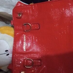 Micheal kors purse,red, silver satin interior, adjustable strap, with matching c